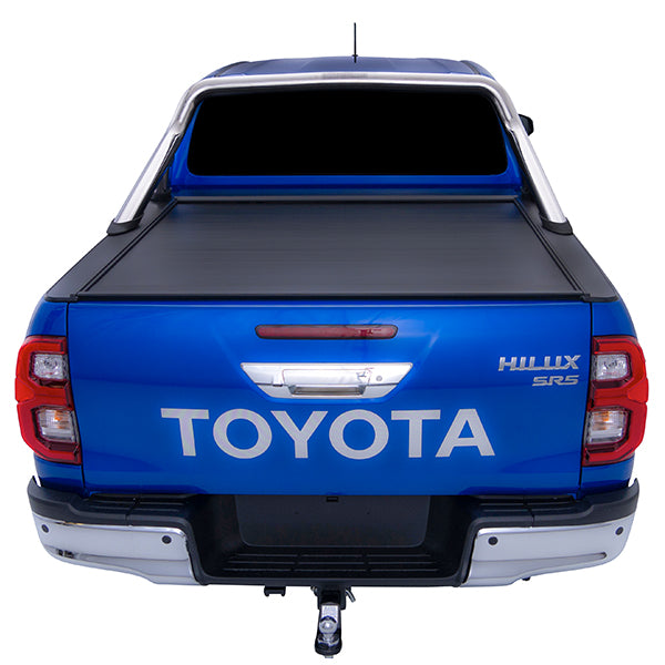 Blue Toyota Hilux SR5 with chrome roll top and roller cover closed straight rear studio image