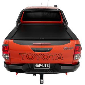 Rear view of orange Toyota Hilux Rugged X with HSP Roll Top and HSP Roller Cover closed