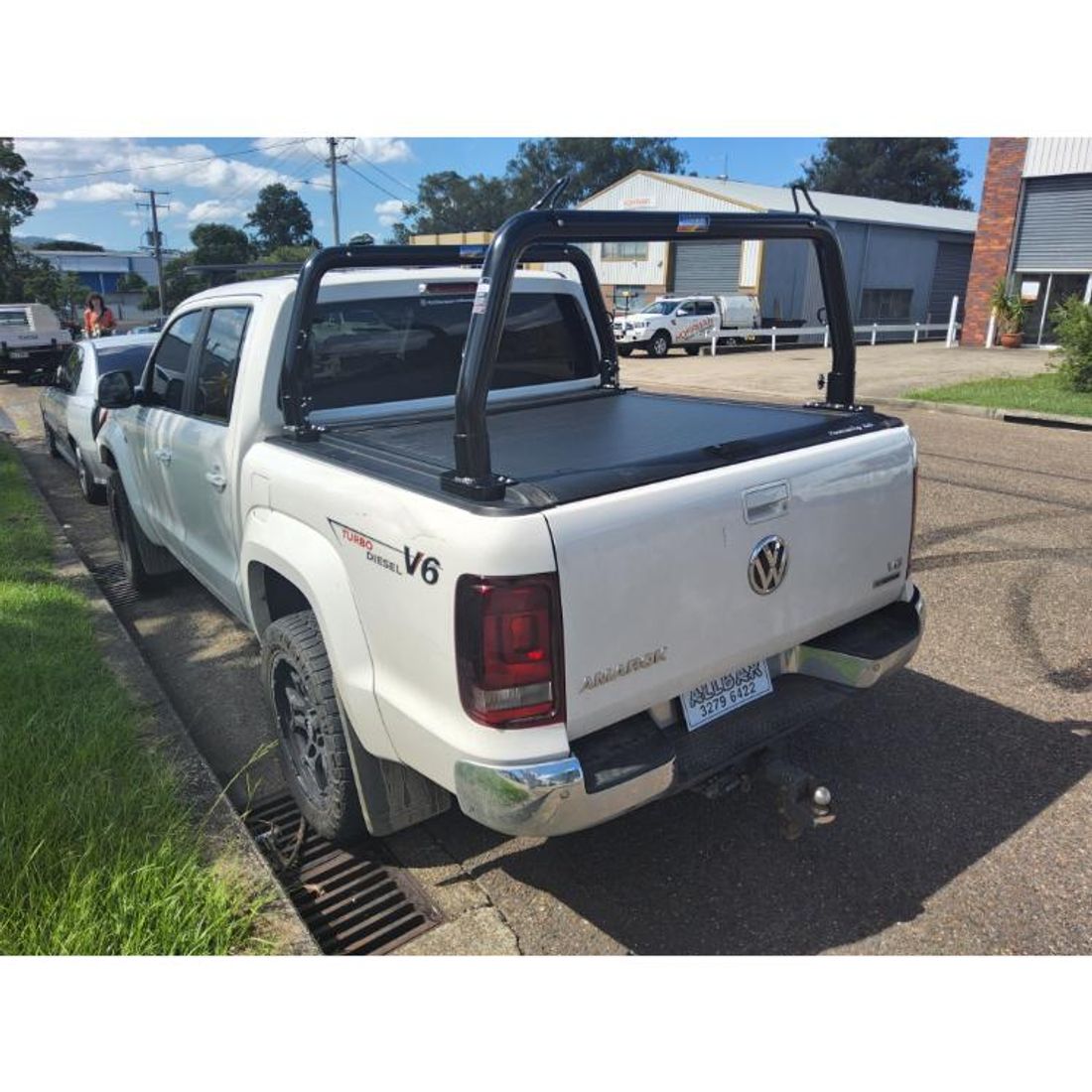 P/Coated Black 76mm Removable Style Racks with Fold Down Ears to suit 2021 VW Amarok with Mountain Top Roller Shutter