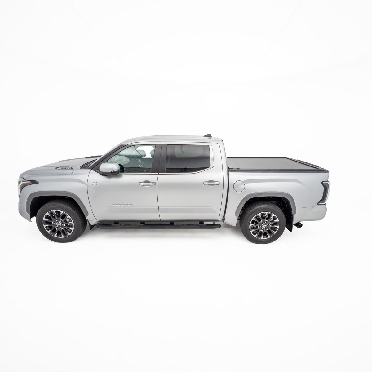 Side view of silver Toyota Tundra dual cab fitted with closed HSP Roller Cover